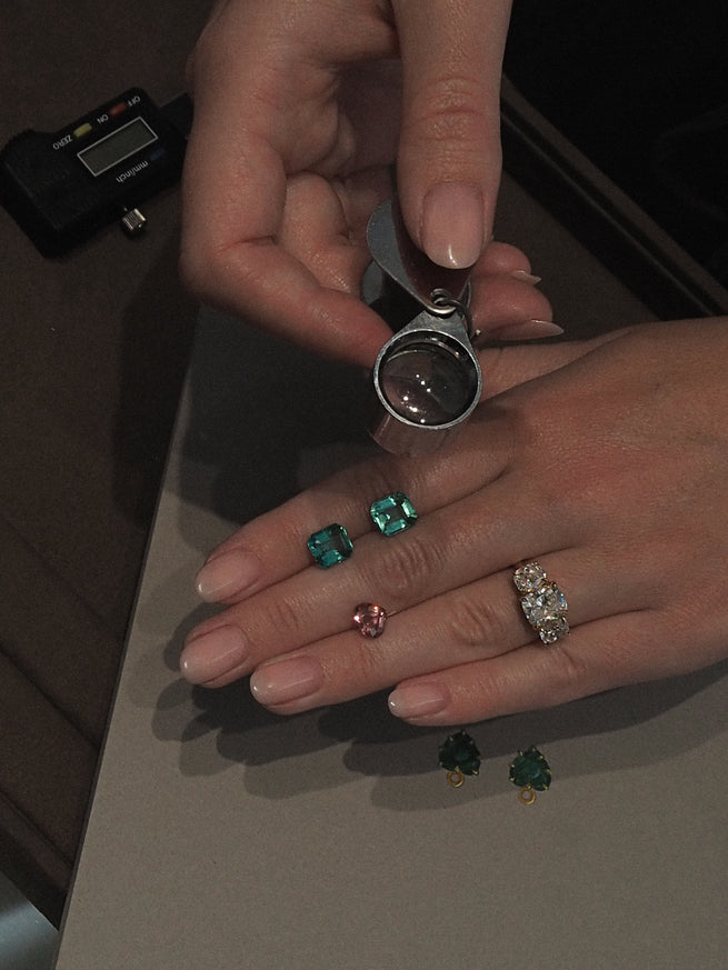 Half Bezel Emerald Solitaire