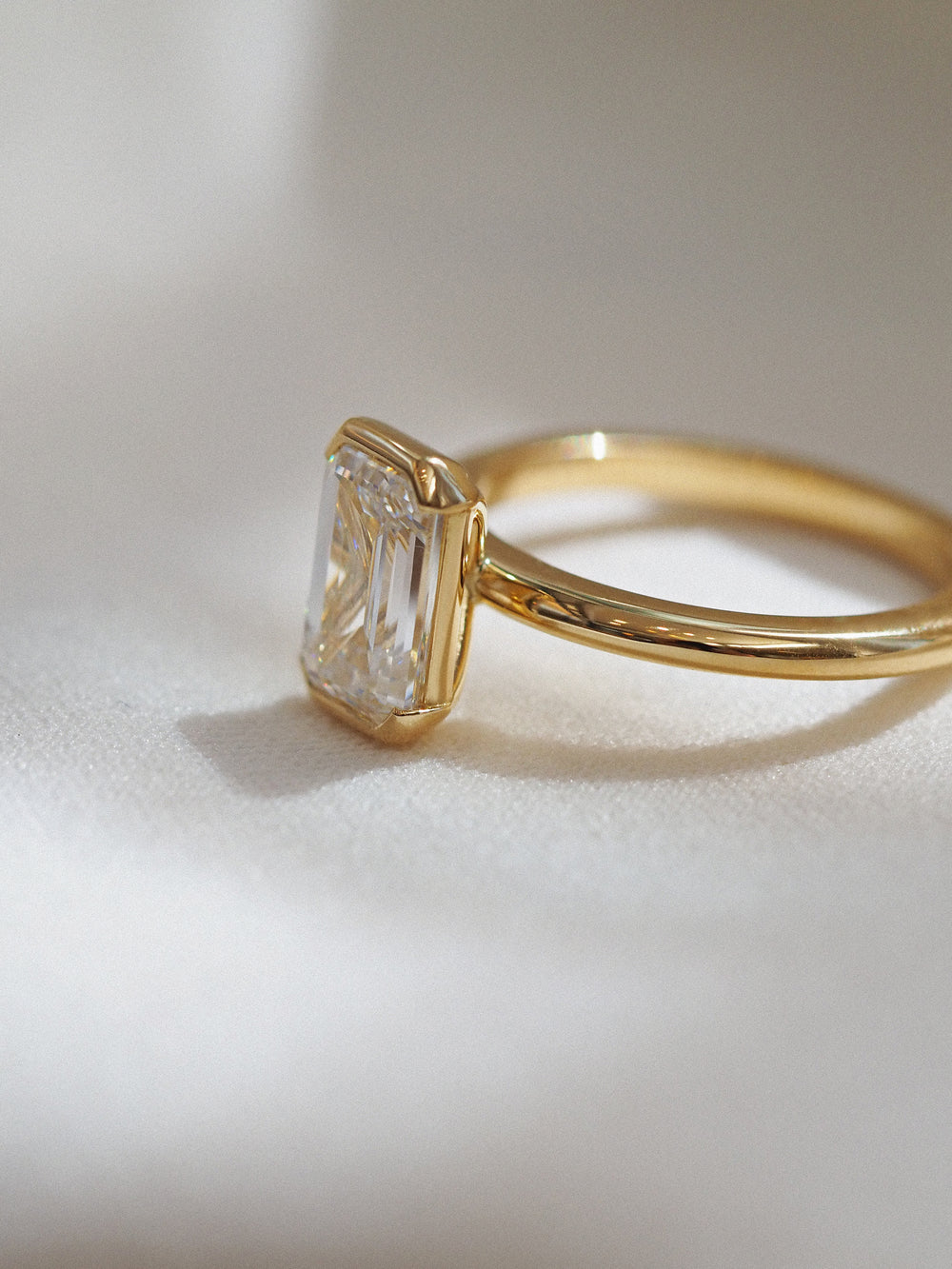 Half Bezel Emerald Solitaire - View